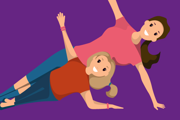 Two ladies practising yoga