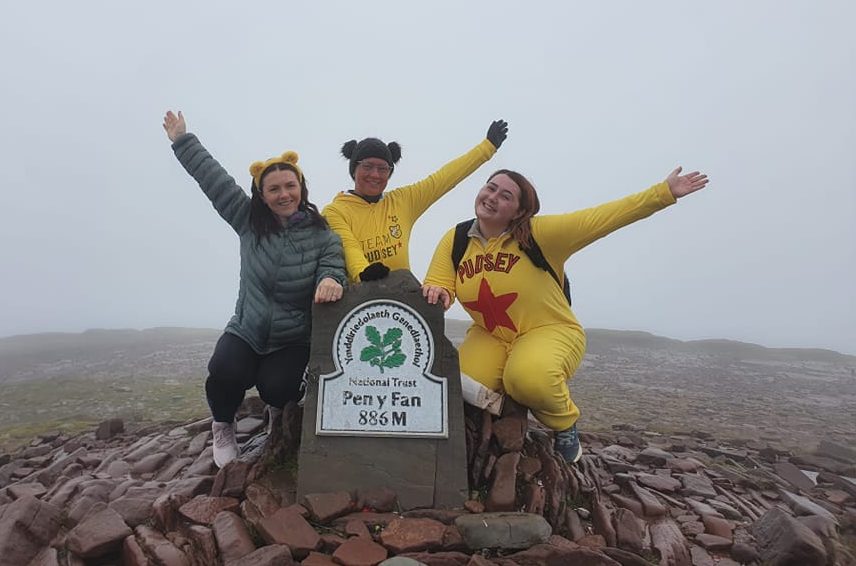 Young Adult Carers support team atop Pen y fan